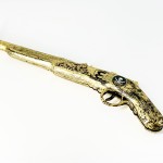 Пистолет трещетка Пиратская история золотой Пистолет трещетка Пиратская история золотой