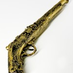 Пистолет трещетка Пиратская история золотой Пистолет трещетка Пиратская история золотой